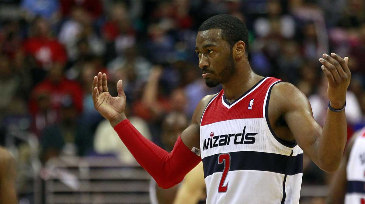 Washington Wizards point guard John Wall (2) celebrates on the court against the Memphis Grizzlies in the fourth quarter at Verizon Center. The Wizards won 107- 94.
