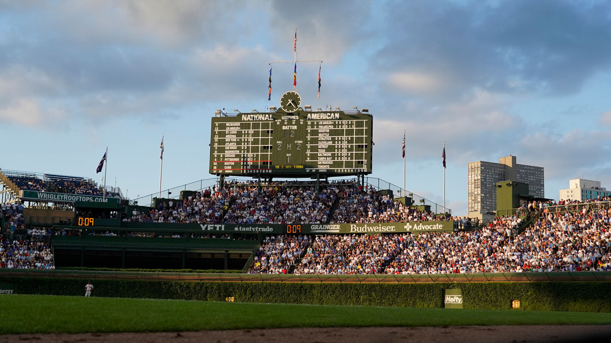 A general view of the bleachers and scoreboard during the fifth inning of a game between the Chicago Cubs and the Boston Red Sox at Wrigley Field.