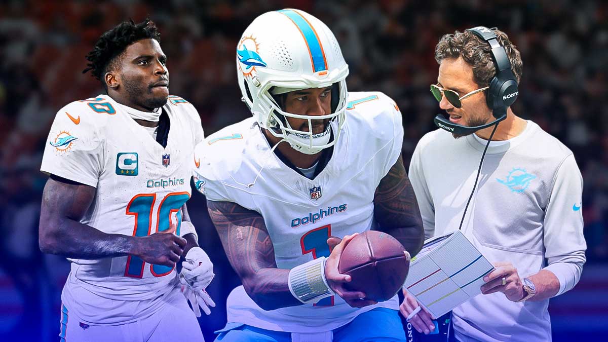 Miami Dolphins star Tua Tagovailoa in the middle with Mike McDaniel and Tyreek Hill on either side in front of Hard Rock Stadium.