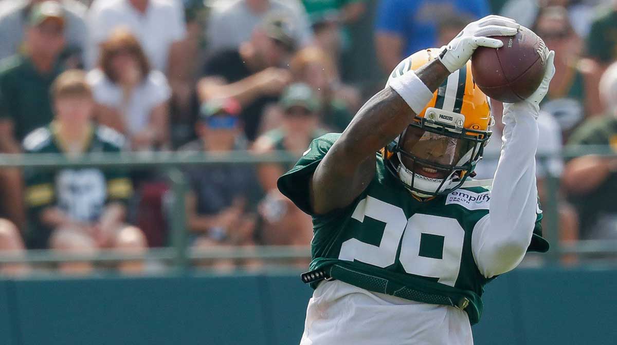 Green Bay Packers safety Xavier McKinney (29) runs through a drill during practice