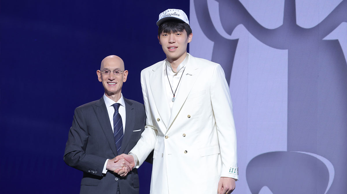 Yang Hansen stands with NBA commissioner Adam Silver after being selected as the 16th pick by the Memphis Grizzlies in the first round of the 2025 NBA Draft at Barclays Center.