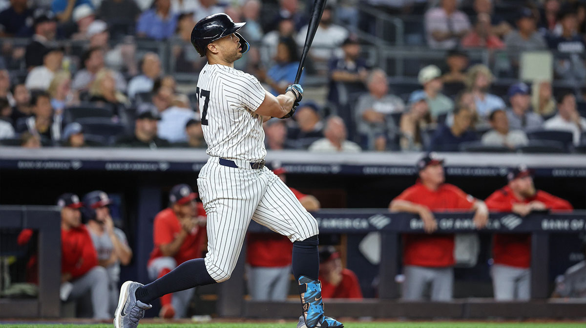 New York Yankees right fielder Giancarlo Stanton (27) hits a two run home run in the sixth inning against the Washington Nationals at Yankee Stadium.
