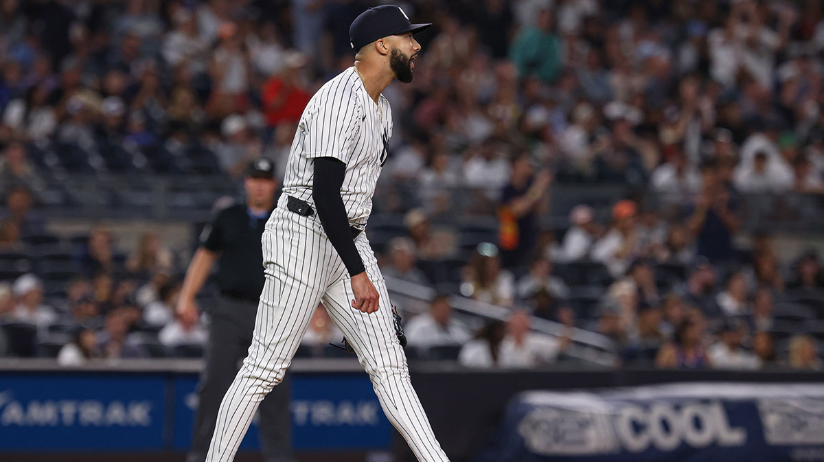 New York Yankees relief pitcher Devin Williams (38) reacts after allowing an RBI single to Houston Astros shortstop Carlos Correa (1) during the tenth inning at Yankee Stadium.