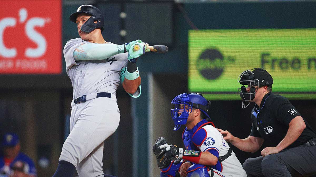 New York Yankees designated hitter Aaron Judge (99) hits a single during the seventh inning against the Texas Rangers at Globe Life Field.