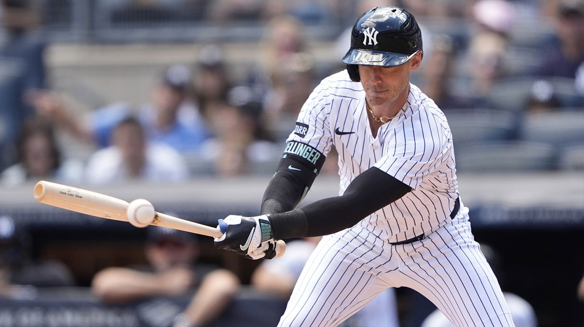 New York Yankees left fielder Cody Bellinger (35) hits an infield single against the Washington Nationals during the first inning at Yankee Stadium.