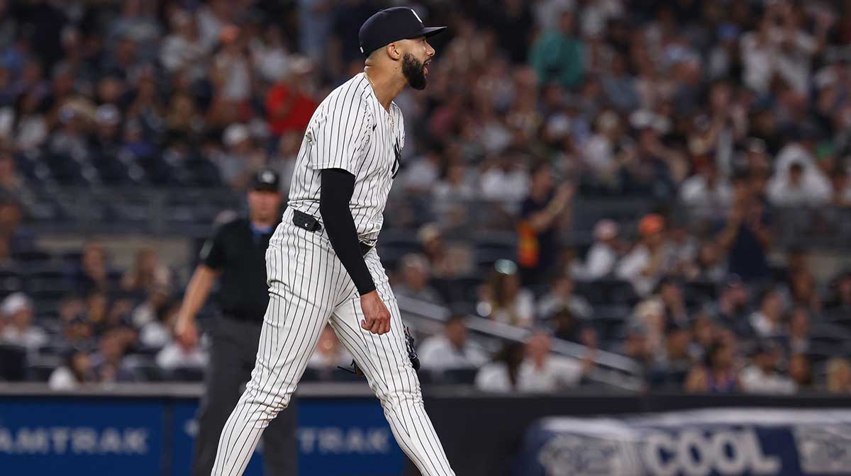 New York Yankees relief pitcher Devin Williams (38) reacts after allowing an RBI single to Houston Astros shortstop Carlos Correa (1) during the tenth inning at Yankee Stadium.