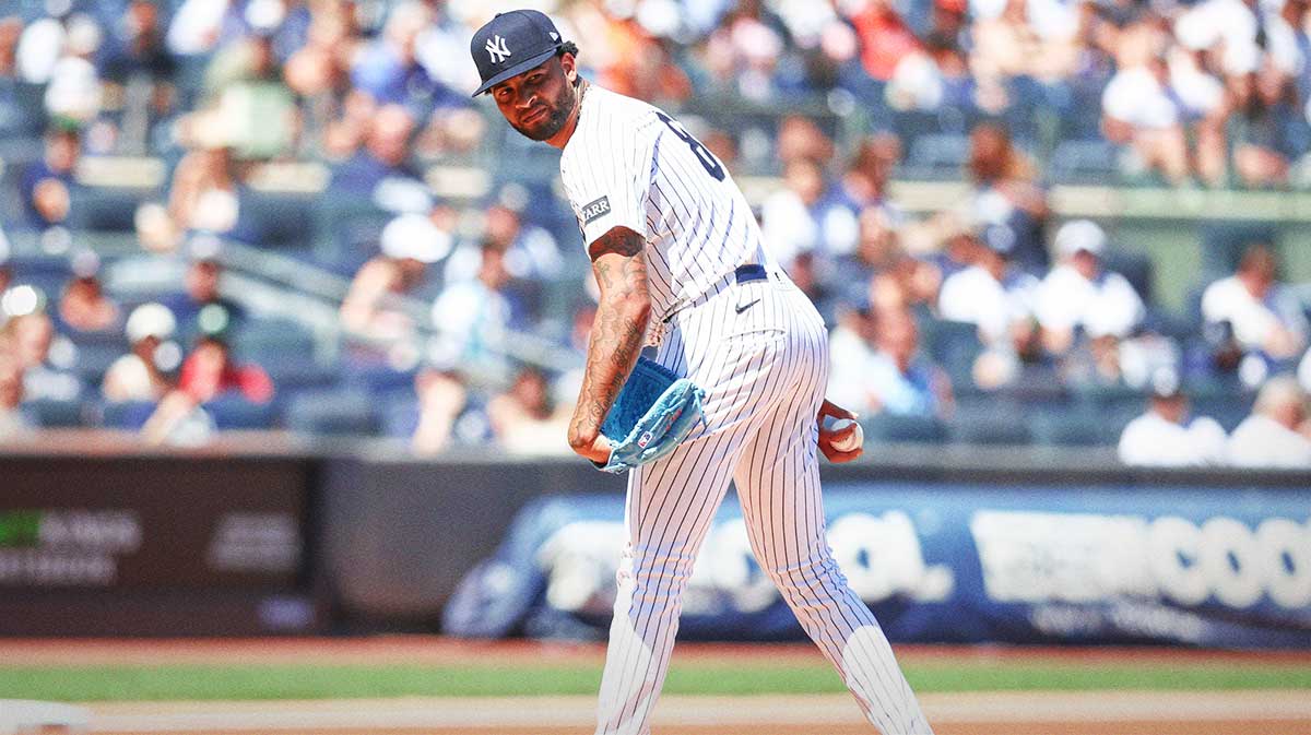 New York Yankees starting pitcher Luis Gil (81) looks a runner back to first base in the first inning against the Houston Astros at Yankee Stadium.