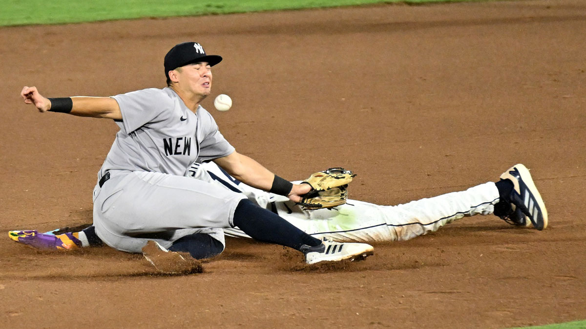 Tampa Bay Rays left fielder Chandler Simpson (14) steals second base as New York Yankees shortstop Anthony Volpe (11) drops the ball in the seventh inning at George M. Steinbrenner Field.