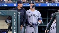 Yankees manager Aaron Boone (17) and New York Yankees center fielder Aaron Judge (99)