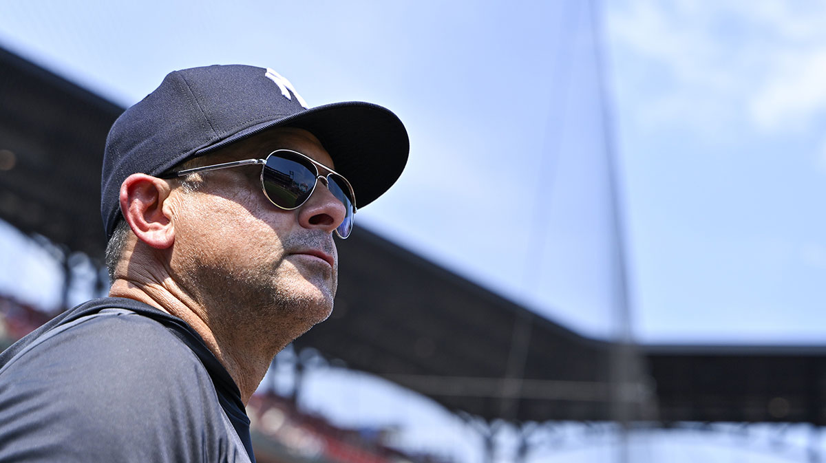 New York Yankees manager Aaron Boone (17) looks on from the dugout during the third inning against the St. Louis Cardinals at Busch Stadium.