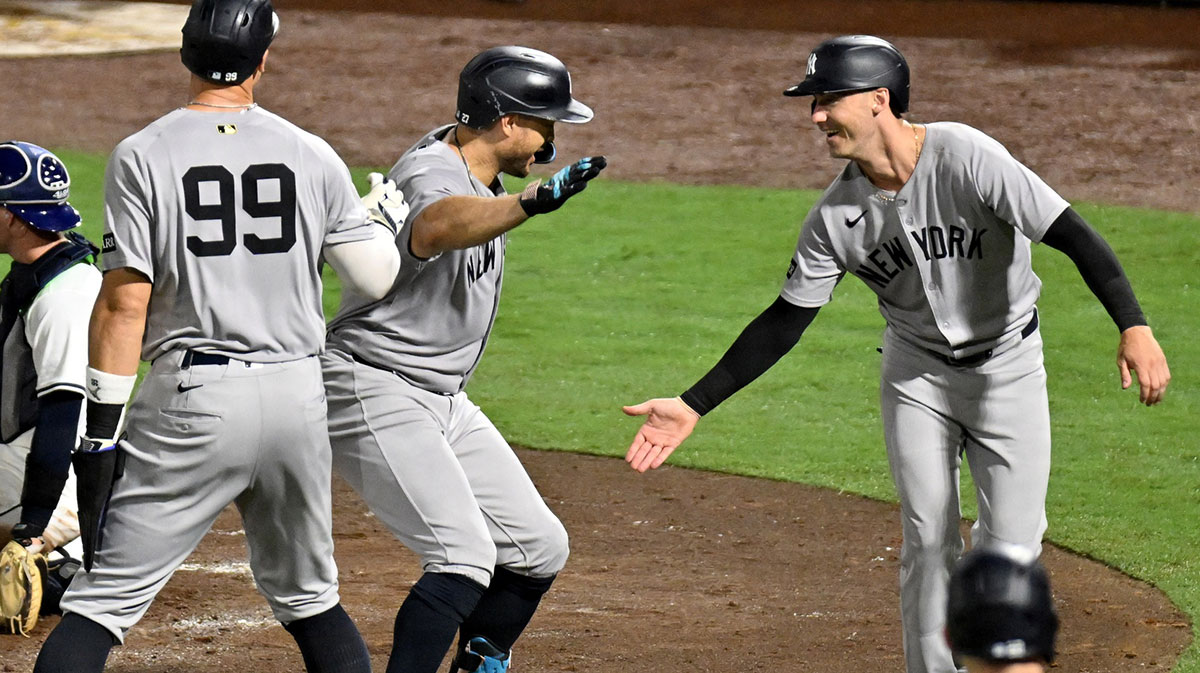 Yankees right fielder fielder Giancarlo Stanton (27) celebrates with left fielder Cody Bellinger (35) and designated hitter Aaron Judge (99)