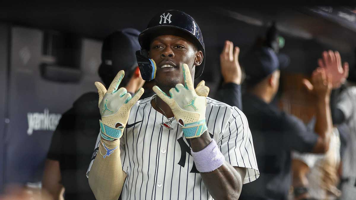 New York Yankees second baseman Jazz Chisholm Jr. (13) celebrates in the dugout after hitting a two run home run in the fifth inning against the Washington Nationals at Yankee Stadium.