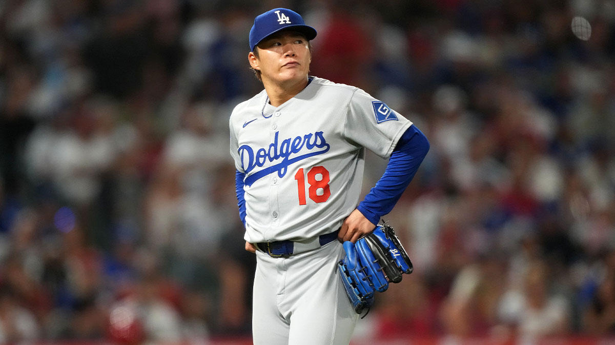 Los Angeles Dodgers starting pitcher Yoshinobu Yamamoto (18) reacts after being removed in the fifth inning against the Los Angeles Angels at Angel Stadium.