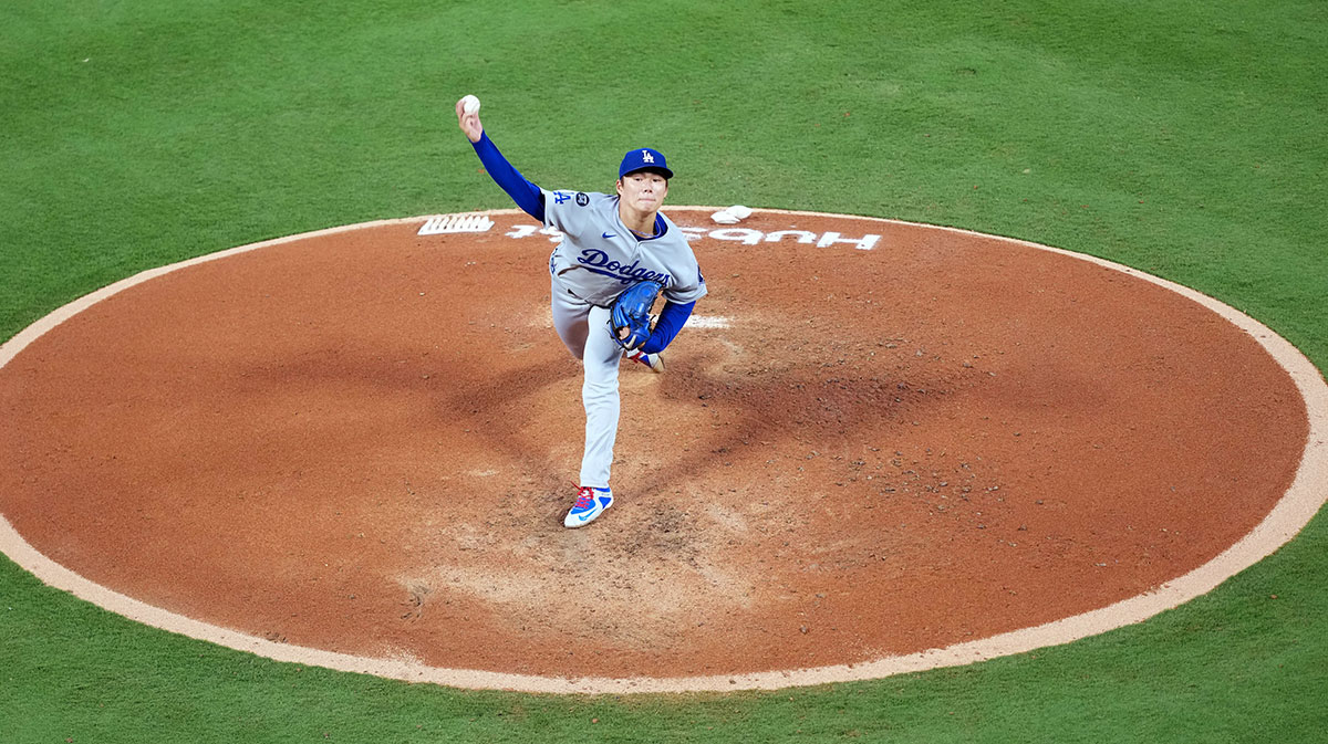 Aug 11, 2025; Anaheim, California, USA; Los Angeles Dodgers starting pitcher Yoshinobu Yamamoto (18) throws in the fourth inning against the Los Angeles Angels at Angel Stadium.