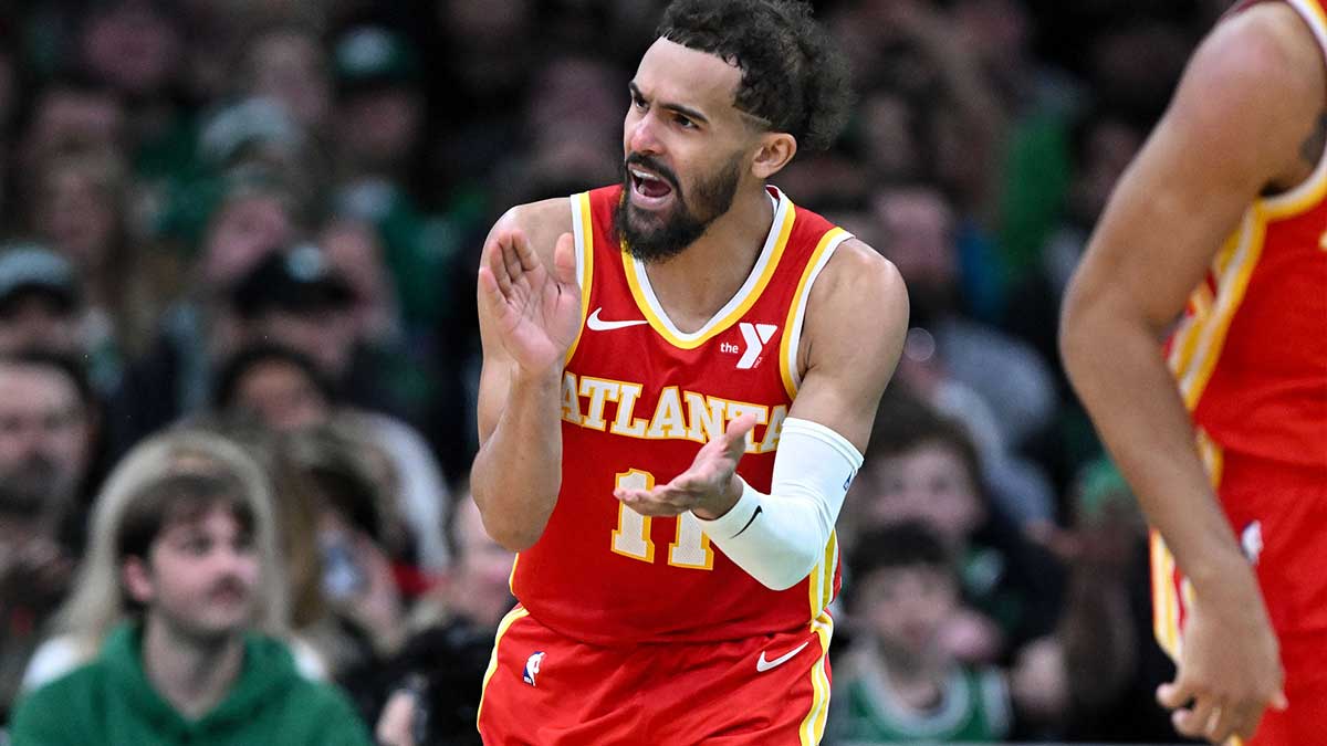 Atlanta Hawks guard Trae Young (11) reacts after scoring against the Boston Celtics during the fourth quarter at the TD Garden.