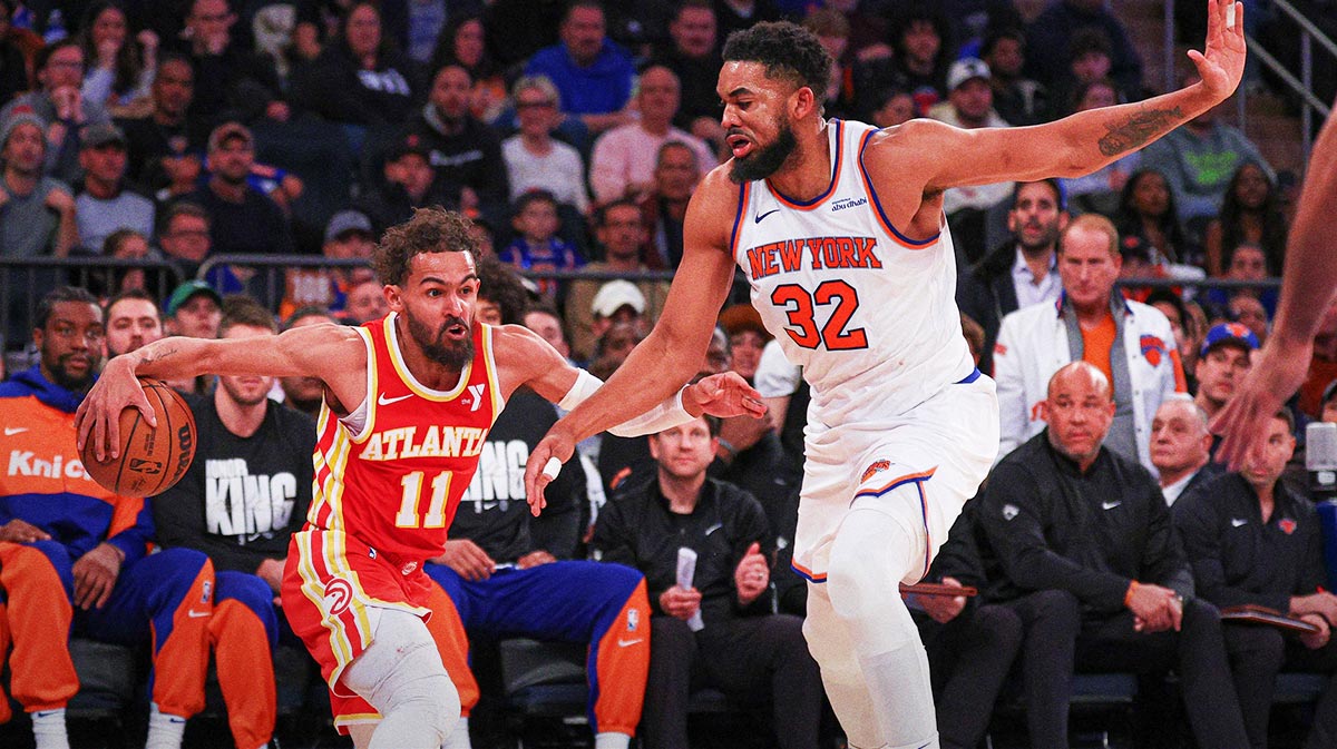 Atlanta Hawks guard Trae Young (11) is guarded by New York Knicks center Karl-Anthony Towns (32) during the second half at Madison Square Garden.