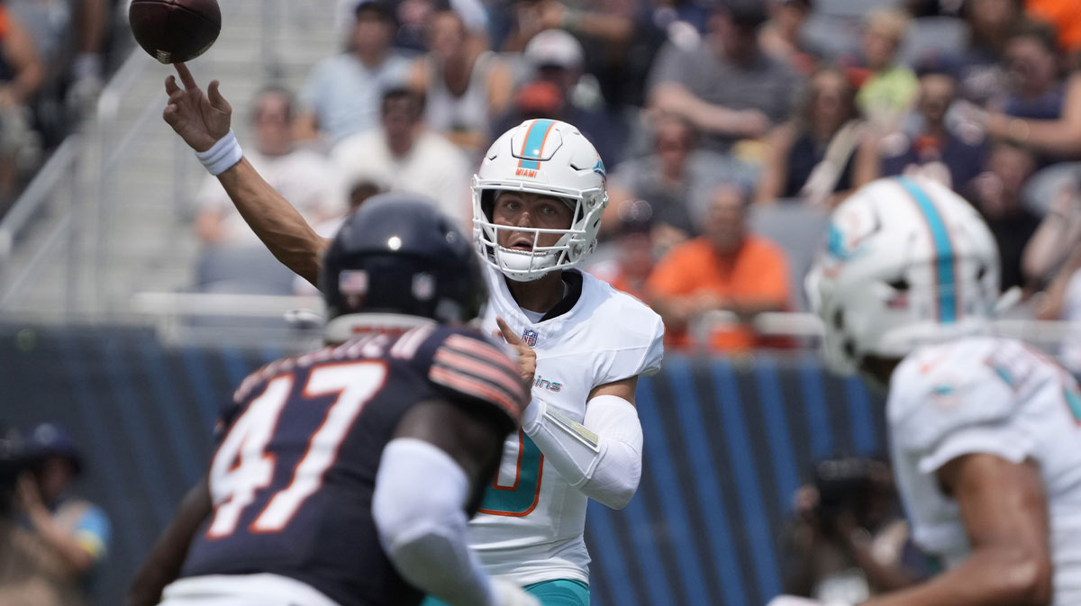 Miami Dolphins quarterback Zach Wilson (0) passes the ball over Chicago Bears linebacker Ruben Hyppolite II (47) during the first half at Soldier Field.