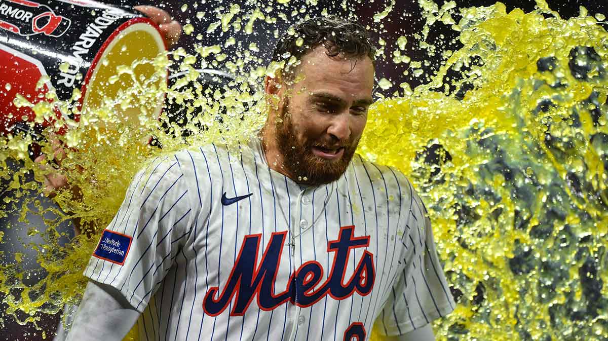 New York Mets outfielder Brandon Nimmo (9) is doused by teammates after hitting a walk off single against the Philadelphia Phillies during the ninth inning at Citi Field.