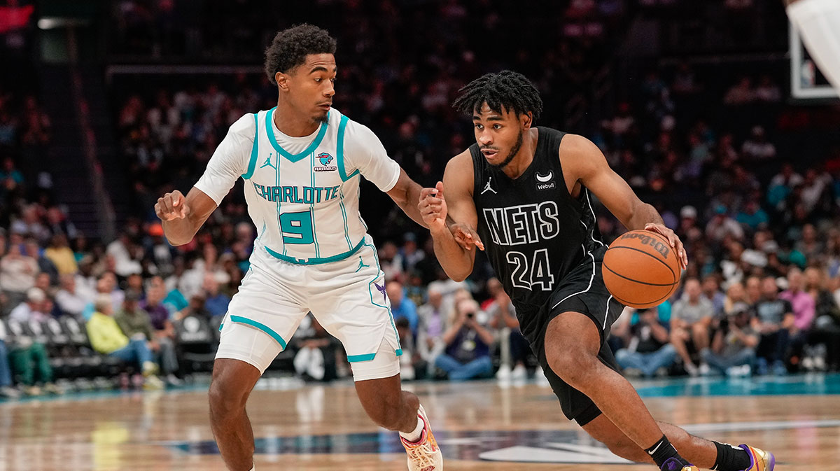 Brooklyn Nets guard Cam Thomas (24) drives to the basket against Charlotte Hornets guard Theo Maledon (9) during the second half at Spectrum Center.