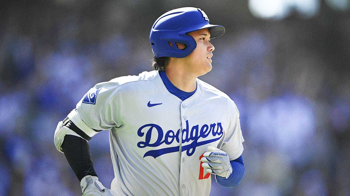 Los Angeles Dodgers designated hitter Shohei Ohtani (17) rounds the bases after hitting a solo home run during the ninth inning against the San Diego Padres at Petco Park.