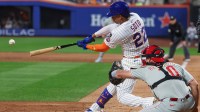 New York Mets right fielder Juan Soto (22) hits an RBI single during the third inning against the Philadelphia Phillies at Citi Field.