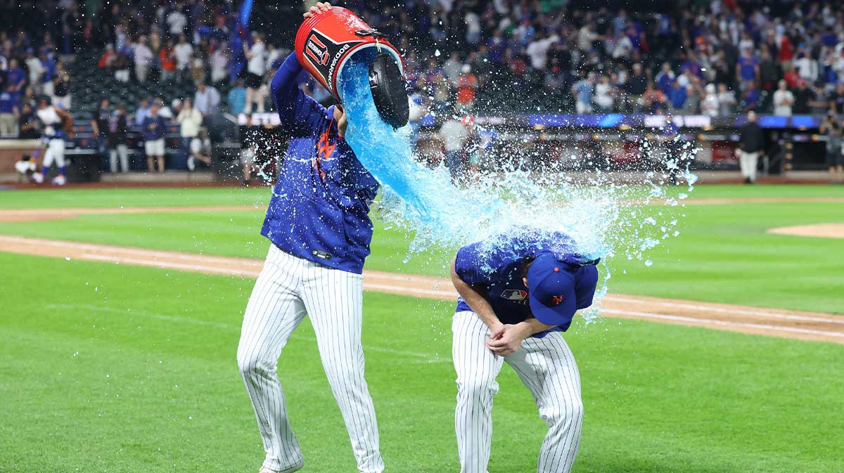 New York Mets starting pitcher Nolan McLean (26) gets splashed after the game against the Philadelphia Phillies at Citi Field.