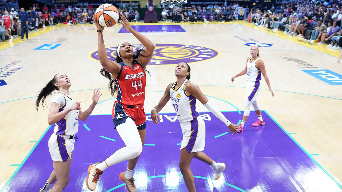 Washington Mystics forward Kiki Iriafen (44) shoots the ball against LA Sparks guard Kelsey Plum (10) and forward Azura Stevens (23) in the second half at Crypto.com Arena.