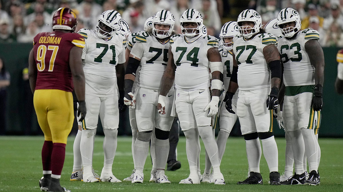 Packers offensive line is shown during the first quarter of their game against the Washington Commanders Thursday, September 11, 2025 at Lambeau Field in Green Bay, Wisconsin. Shown are offensive tackle Anthony Belton (71), guard Sean Rhyan (75), guard Elgton Jenkins (74), offensive tackle Jordan Morgan (77) and offensive tackle Rasheed Walker (63). Packers historic start