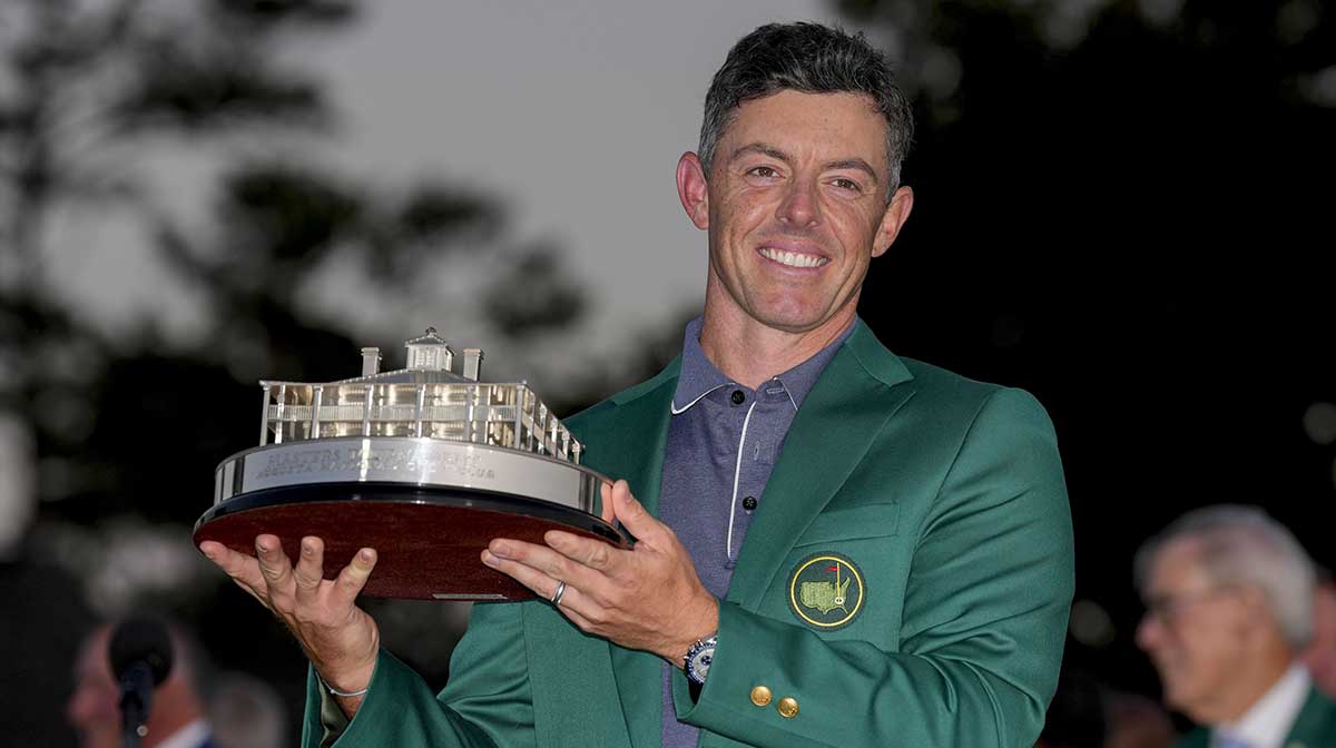 Rory McIlroy holds the Masters championship trophy during the final round of the Masters Tournament at Augusta National Golf Club.
