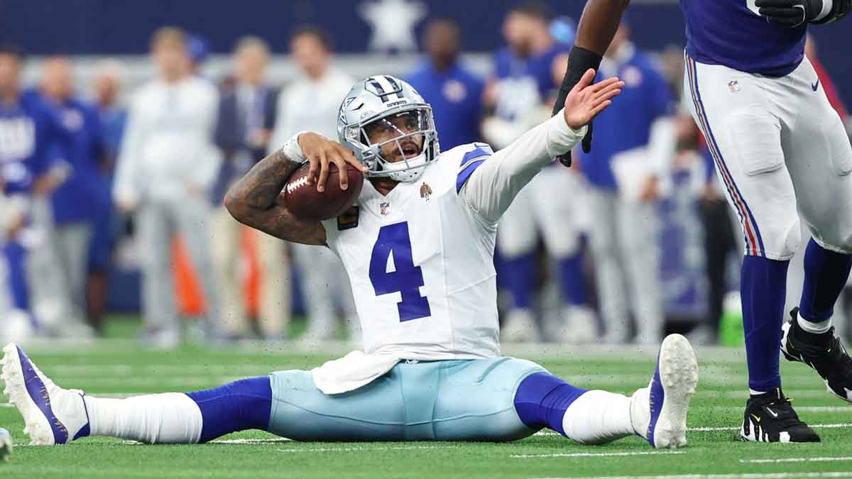 Dallas Cowboys quarterback Dak Prescott (4) reacts after a play against the New York Giants during overtime at AT&T Stadium.