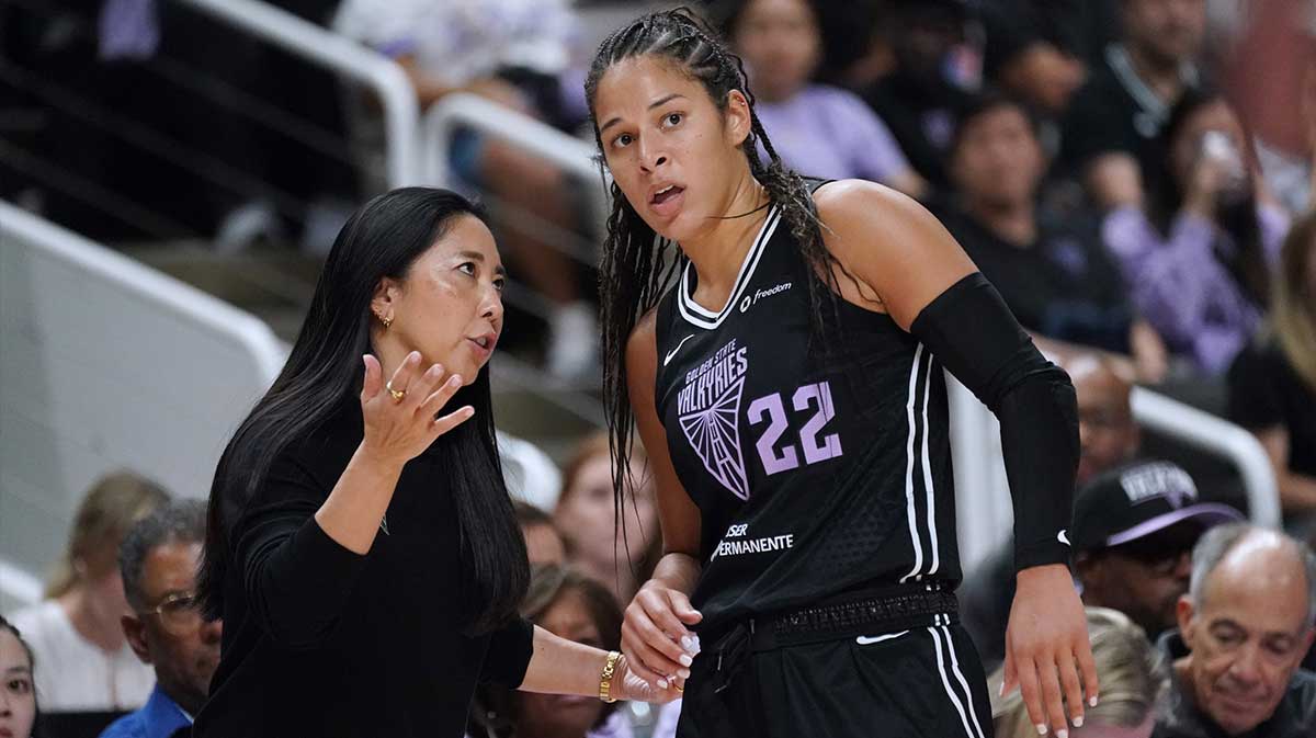 Golden State Valkyries head coach Natalie Nakase talks with guard Veronica Burton (22) in the fourth quarter against the Minnesota Lynx in game two of round one for the 2025 WNBA Playoffs at SAP Center.