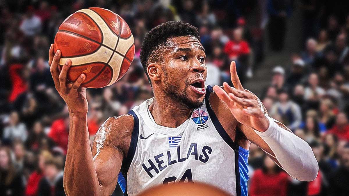 Giannis Antettokounmpo in greece jersey with a basketball in one hand. 3 Giannis Antettokounmpo bold predictions for Greece’s EuroBasket semifinal vs. Turkey