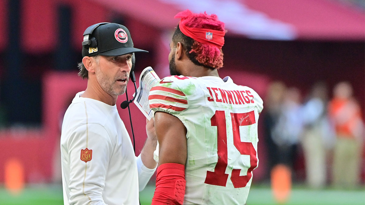 San Francisco 49ers wide receiver Jauan Jennings (15) talks with head coach Kyle Shanahan after being ejected in the first half against the Arizona Cardinals at State Farm Stadium.