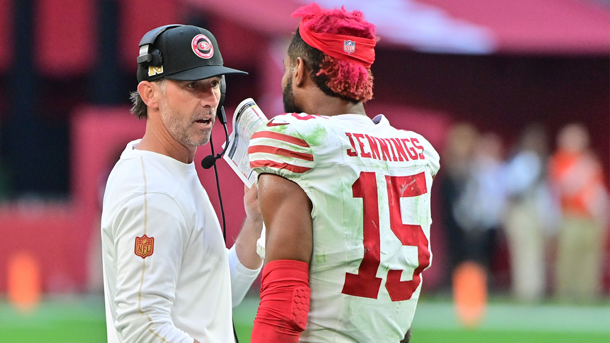 San Francisco 49ers wide receiver Jauan Jennings (15) talks with head coach Kyle Shanahan after being ejected in the first half against the Arizona Cardinals at State Farm Stadium.