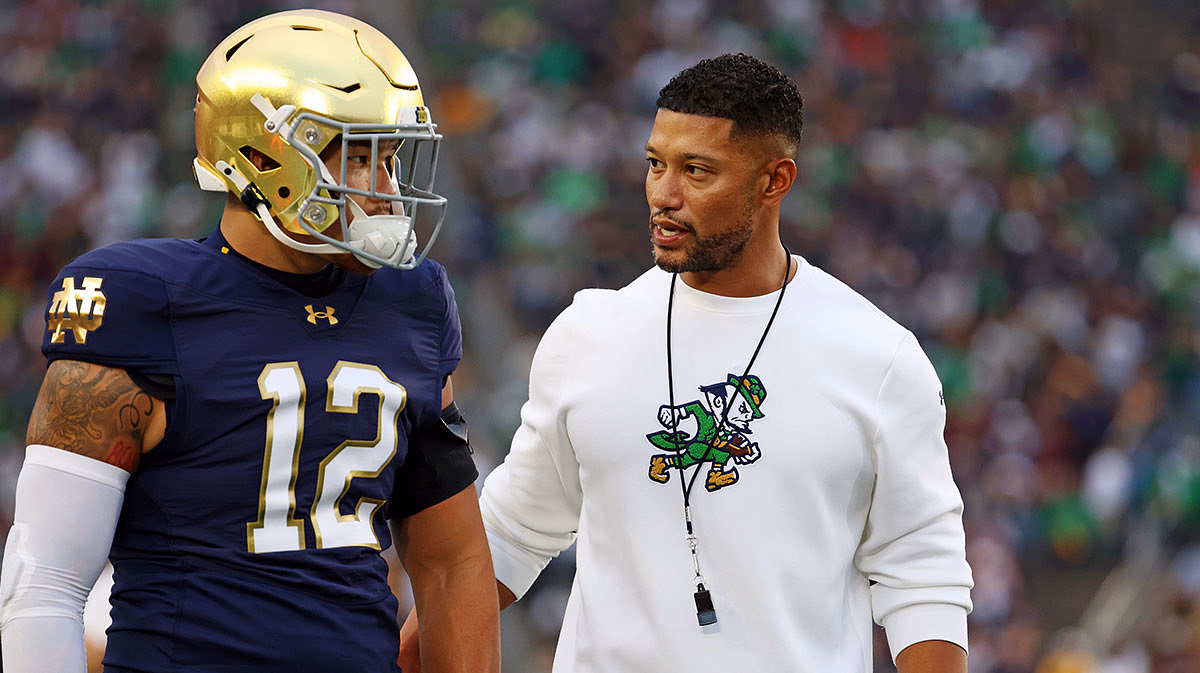 Notre Dame Fighting Irish head coach Marcus Freeman reacts with Notre Dame Fighting Irish quarterback Blake Hebert (12) during the first half against the Texas A&M Aggies at Notre Dame Stadium.