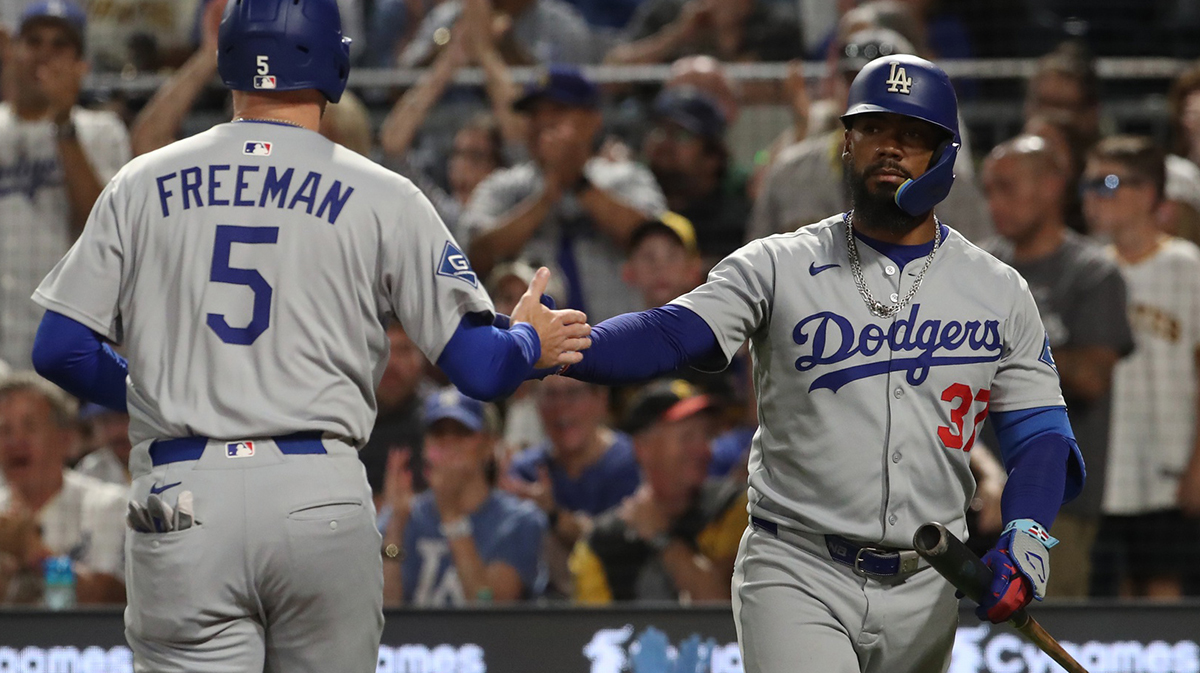 Los Angeles Dodgers right fielder Teoscar Hernandez (37) greets first baseman Freddie Freeman (5) crossing home plate to score a run against the Pittsburgh Pirates during the seventh inning at PNC Park.