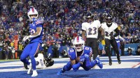 Baltimore Ravens cornerback Jaire Alexander (23) watches Buffalo Bills wide receiver Keon Coleman (0) score a touchdown during the fourth quarter at Highmark Stadium.