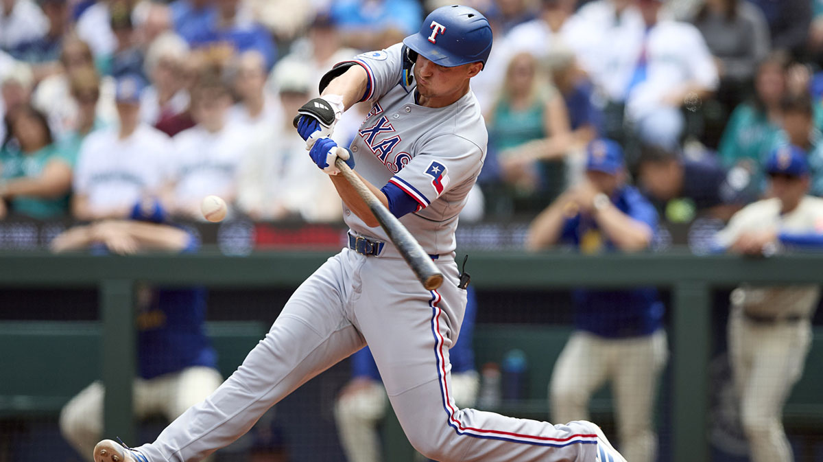Texas Rangers shortstop Corey Seager (5) hits a two run home run off Seattle Mariners starting pitcher Logan Evans (73) during the third inning at T-Mobile Park. 