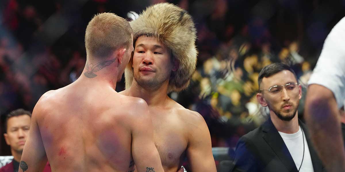 Shavkat Rakhmonov (red gloves) reacts with Ian Machado Garry (blues gloves) after their fight at T-Mobile Arena.
