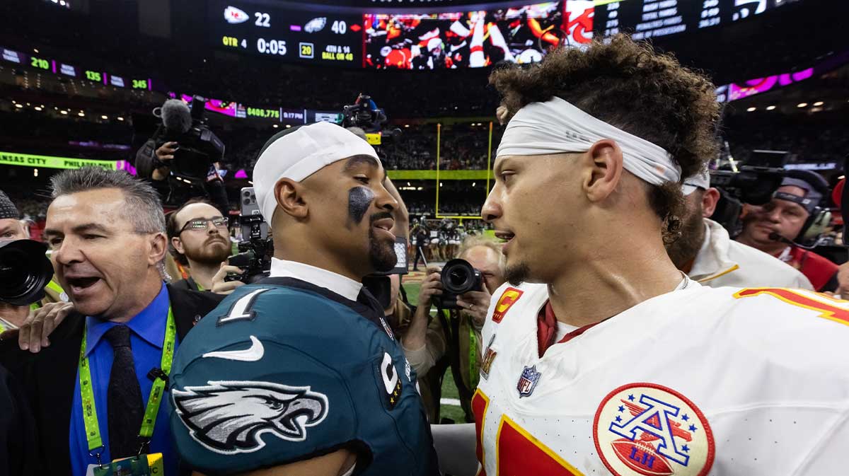 Philadelphia Eagles quarterback Jalen Hurts (1) greets Kansas City Chiefs quarterback Patrick Mahomes (15) following Super Bowl LIX at Ceasars Superdome.