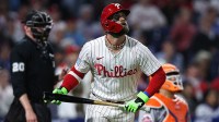 Philadelphia Phillies first base Bryce Harper (3) watches his ball clear the wall for a home run against the New York Mets during the seventh inning at Citizens Bank Park.