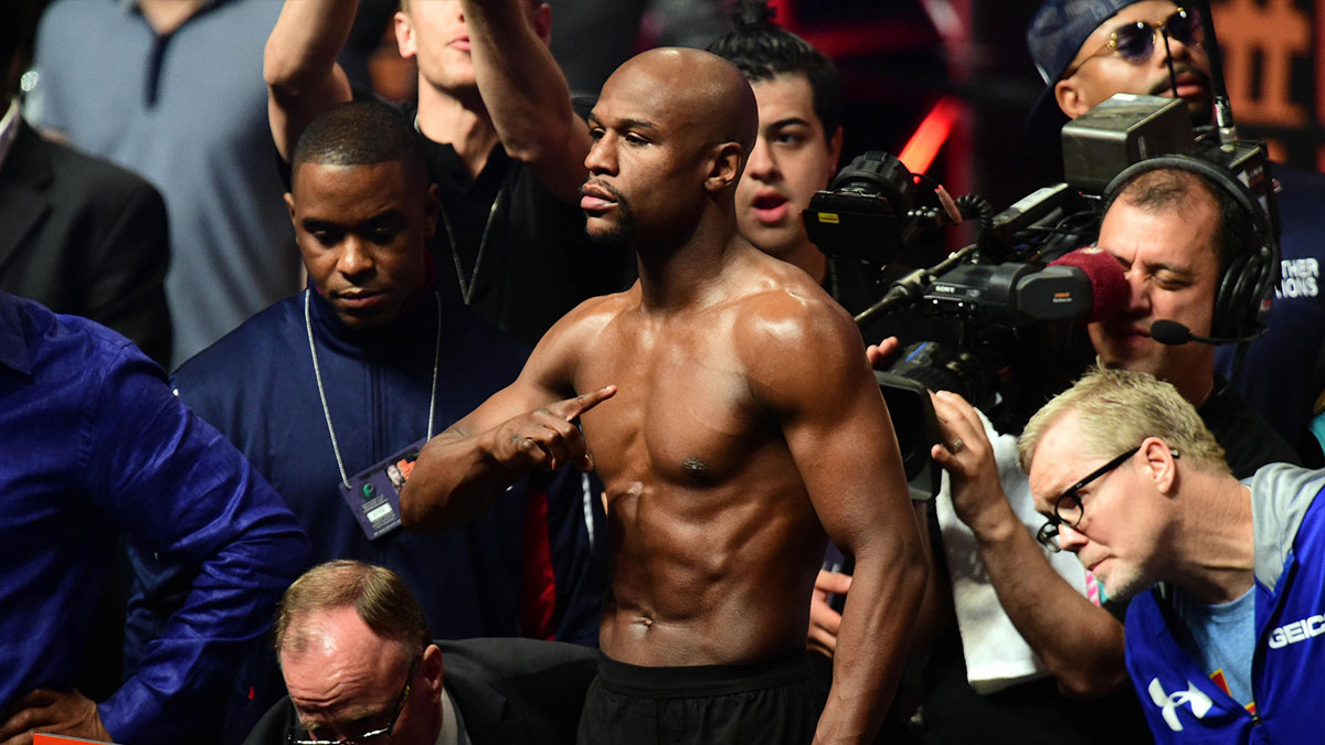 Floyd Mayweather weighs in for his bout against Manny Pacquiao during weigh-ins for the upcoming boxing fight at MGM Grand Garden Arena.