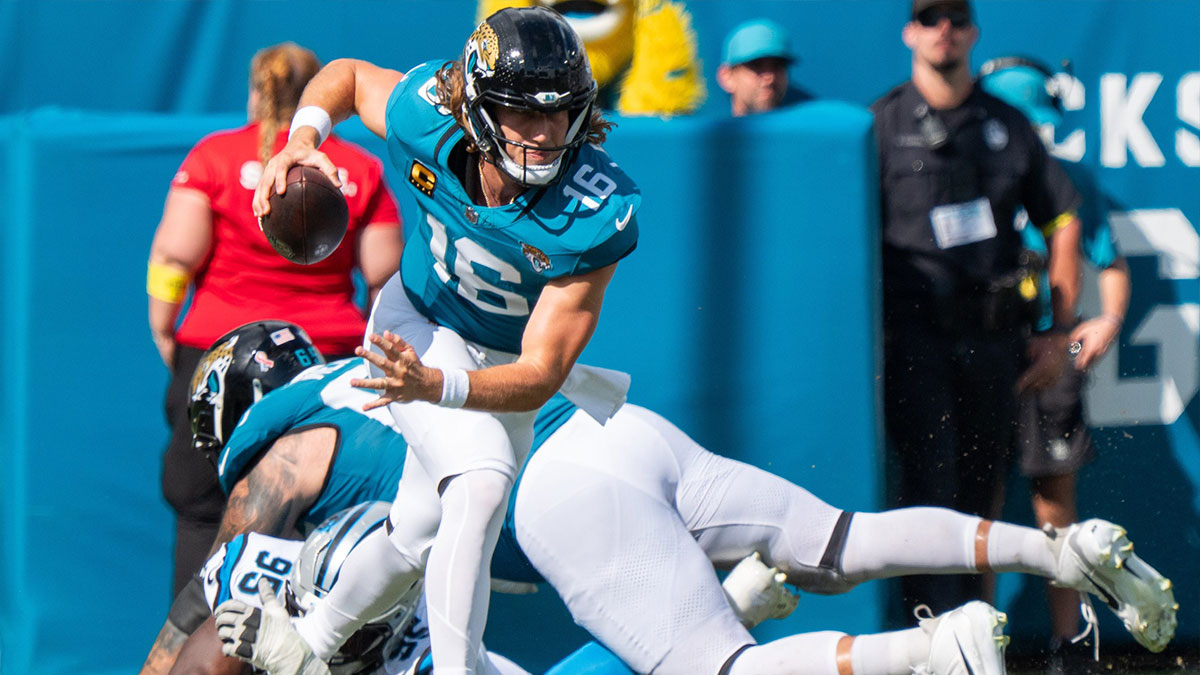 Jacksonville Jaguars quarterback Trevor Lawrence (16) eludes Carolina Panthers defensive end Derrick Brown (95) during the third quarter of an NFL football game between the Carolina Panthers at Jacksonville Jaguars at EverBank Stadium Sunday September 7, 2025. Jaguars defeated the Panthers 26-10.