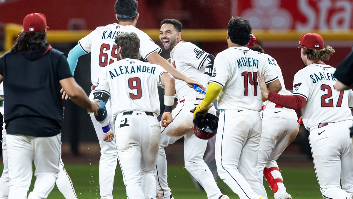 Arizona Diamondbacks infielder Jordan Lawlar celebrates with teammates after hitting an RBI walk off single in the ninth inning against the San Francisco Giants at Chase Field. 