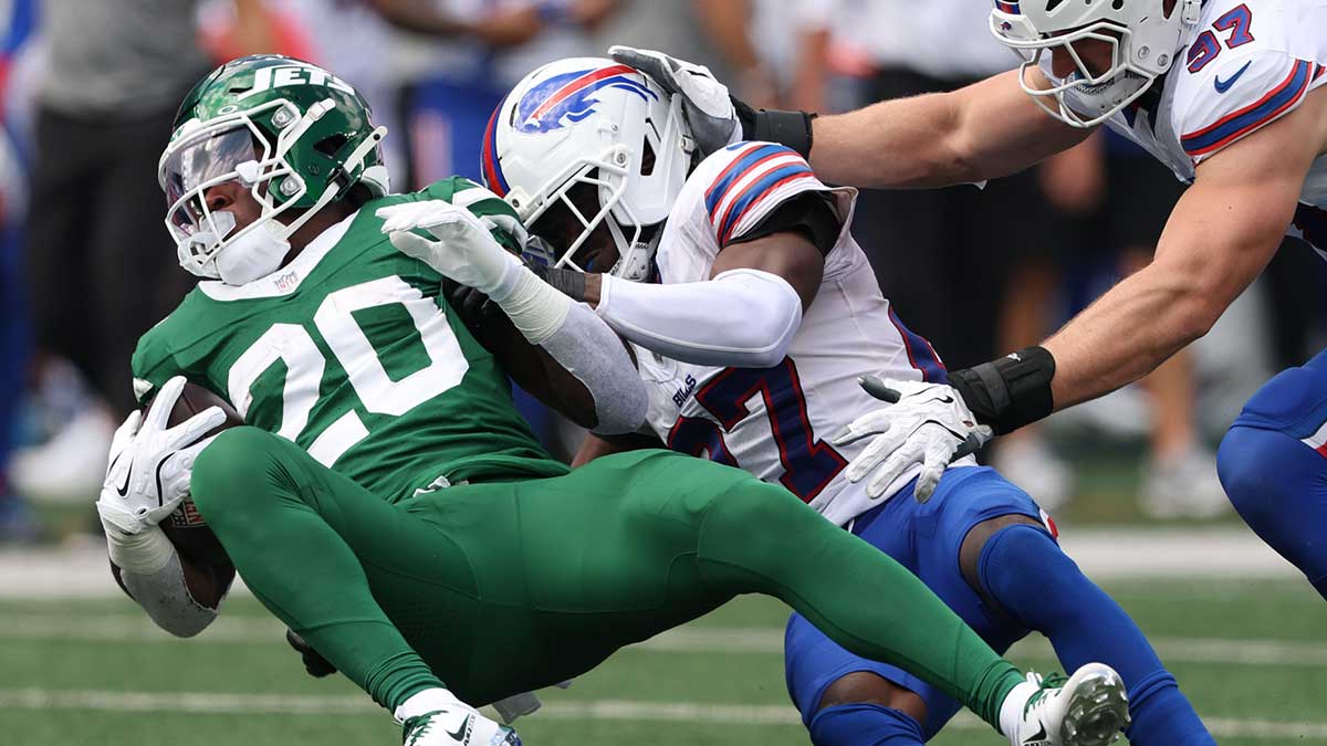 Buffalo Bills cornerback Tre'Davious White (27) tackles New York Jets running back Breece Hall (20) during the first half at MetLife Stadium.