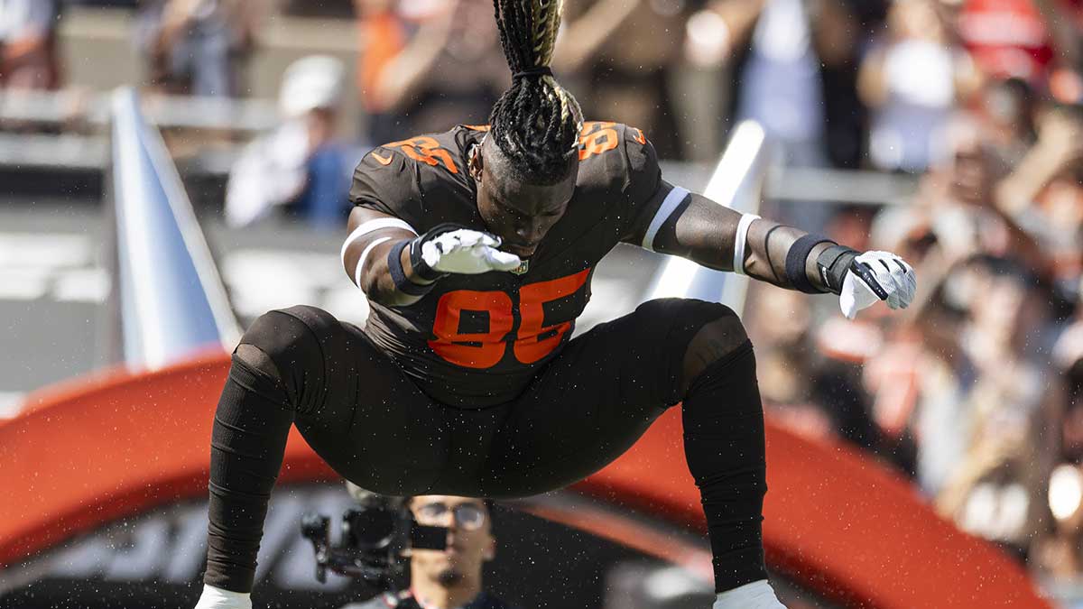 Cleveland Browns tight end David Njoku (85) leaps onto the field during player introductions before the game against the Green Bay Packers at Huntington Bank Field.