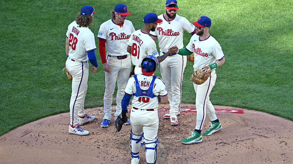Philadelphia Phillies pitcher Cristopher Sánchez (61) is congratulated by first base Bryce Harper (3) and teammates before being removed from the game against the Minnesota Twins during the sixth inning at Citizens Bank Park. 