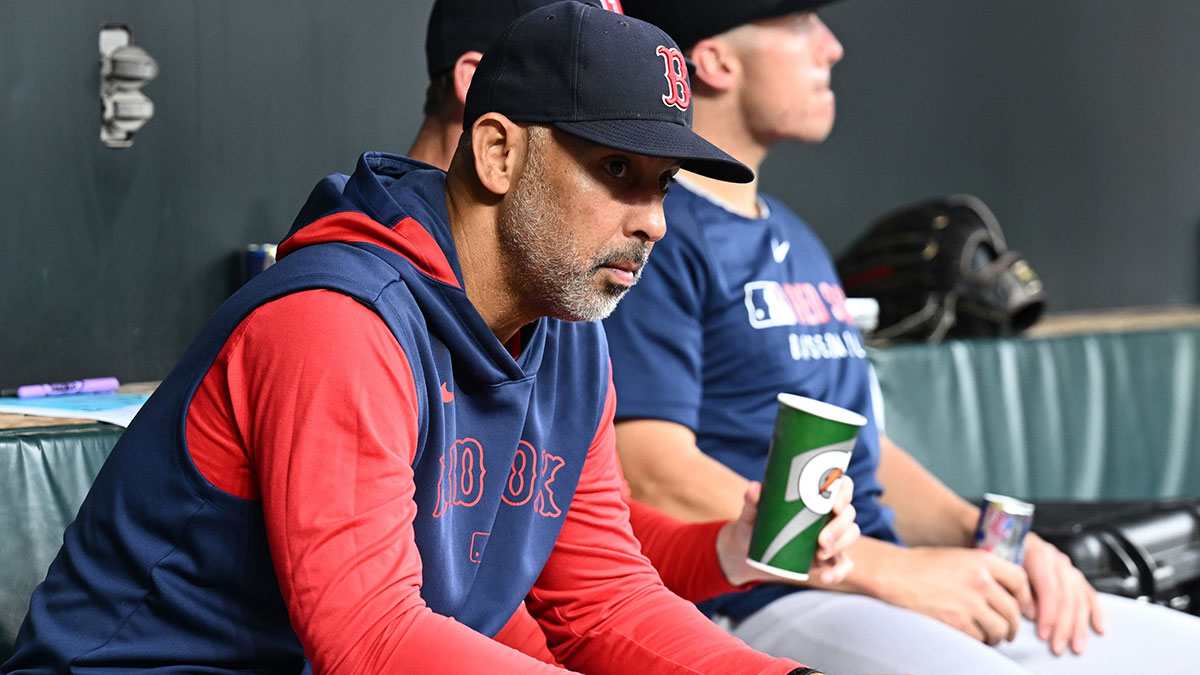 Boston Red Sox manager Alex Cora (13) sits in the dugout before the game between the Baltimore Orioles and the Boston Red Sox at Oriole Park at Camden Yards.