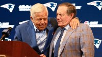 New England Patriots former head coach Bill Belichick (right) embraces Patriots owner Robert Kraft (left) during a press conference at Gillette Stadium to announce Belichick's exit from the team.