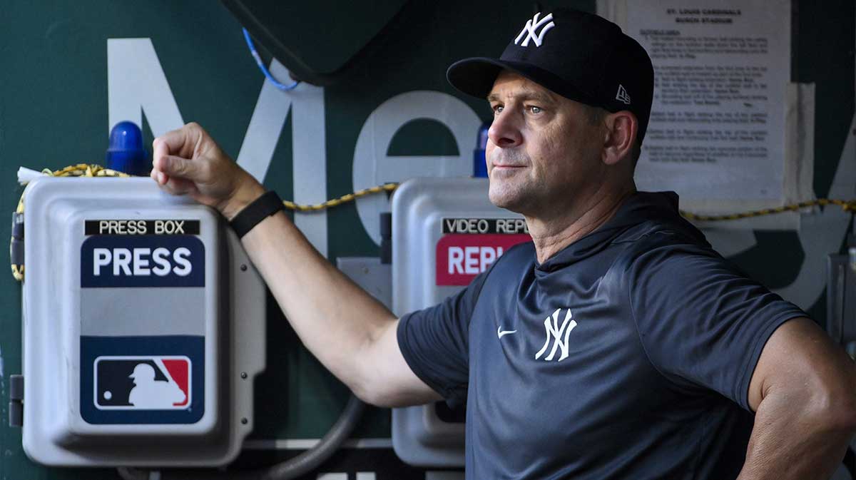New York Yankees manager Aaron Boone (17) looks on from the dugout before a game against the St. Louis Cardinals at Busch Stadium.